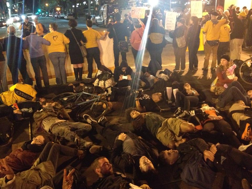 CristinaKTVU's tweet photo. Protestors staging a "die in" &amp; 4.5 minutes of silence in middle of #Oakland street. @ktvu http://t.co/OusZPxcvGS