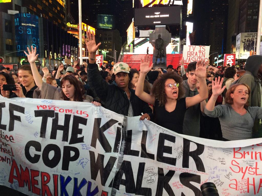 "Hands up Don't shoot" protestors chant in Times Square