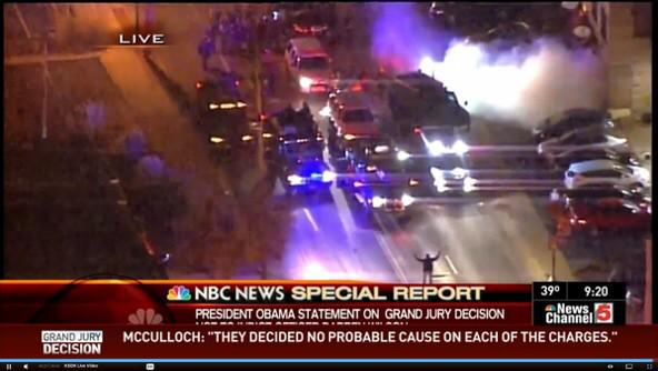 Bipartisanism's tweet image. #Ferguson:  What may become an iconic moment.  One man stands with his hands up blocking armored vehicles.