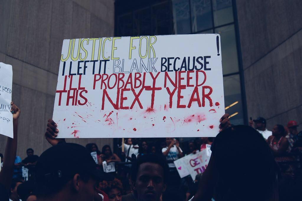 MarkishaJubilee's tweet photo. This is the best protest sign yet...still hurts to look at though #NoIndictment #Ferguson http://t.co/4p4rIHED4o