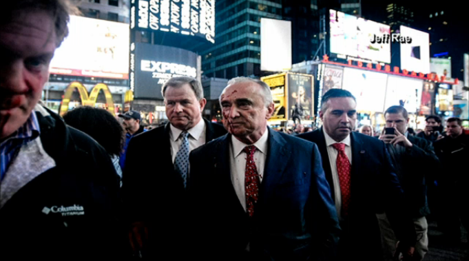 R_0_N's tweet photo. RT @msnbc: NYC Police Commissioner splattered with fake blood at grand jury protest: #FergusonDecision http://t.co/Ip09ih0qeS