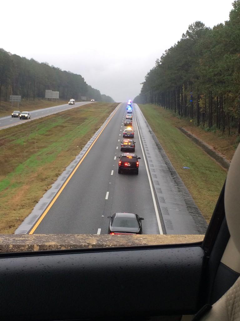 TheFunWest's tweet photo. Pulled over on an I-10 watching the LEO processional for Deputy Chris Smith #RestInPeace http://t.co/lnYnlCZZIy