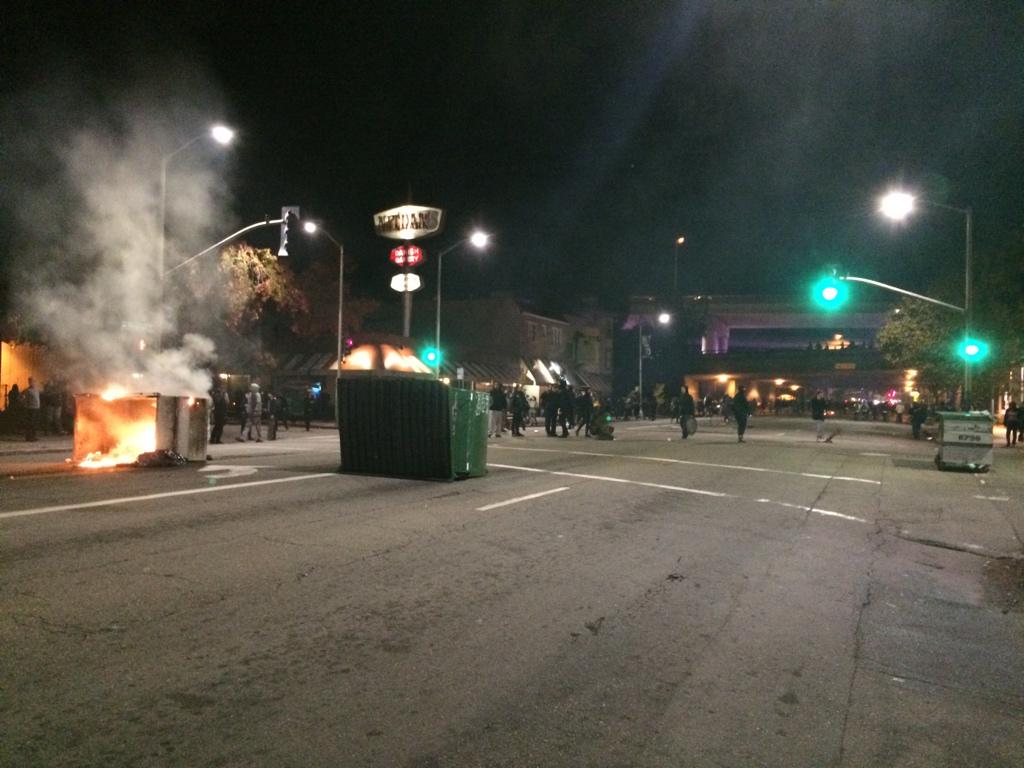 Dumpster fires burning on Telegraph in Oakland