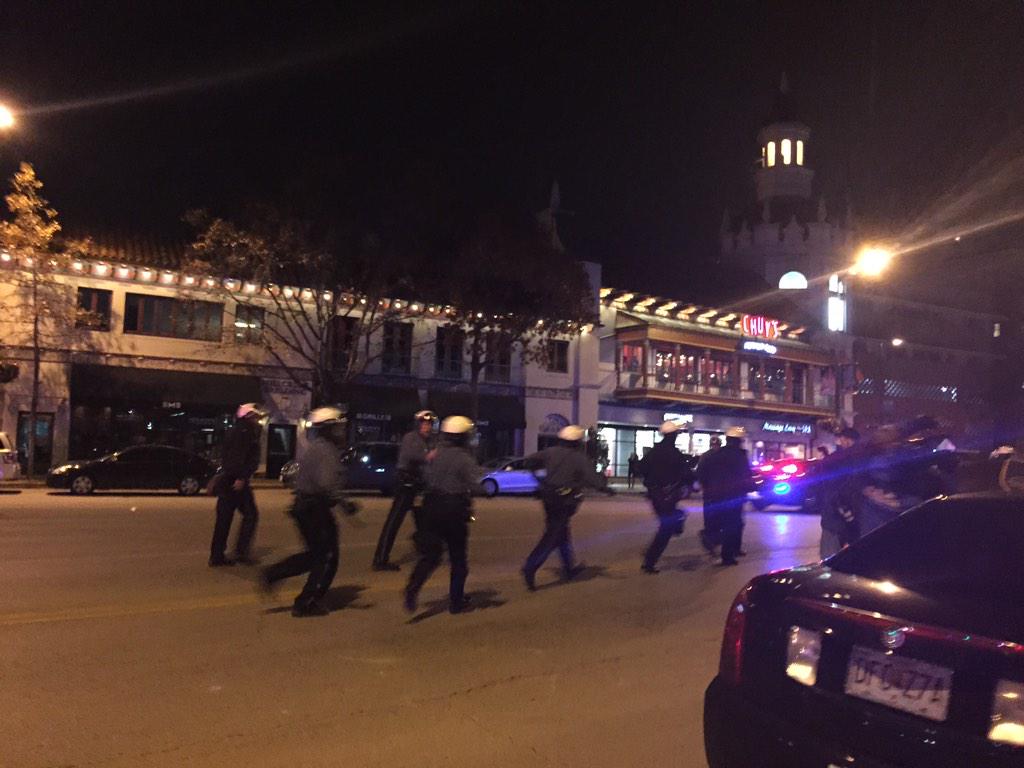 fox4kc's tweet photo. @kcpolice in helmets and on horseback as protesters yell profanities and "hands up, don't shoot!"  http://t.co/rA4mdYNztK ^KB