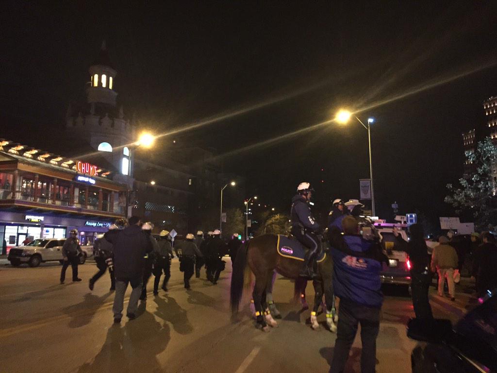 fox4kc's tweet photo. @kcpolice in helmets and on horseback as protesters yell profanities and "hands up, don't shoot!"  http://t.co/rA4mdYNztK ^KB