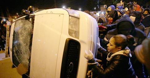 GMA's tweet photo. Rioting occurred at Ferguson’s city hall, with windows broken and a police car vandalized. http://t.co/HheyYboUTa http://t.co/h6mFiQJ5o5