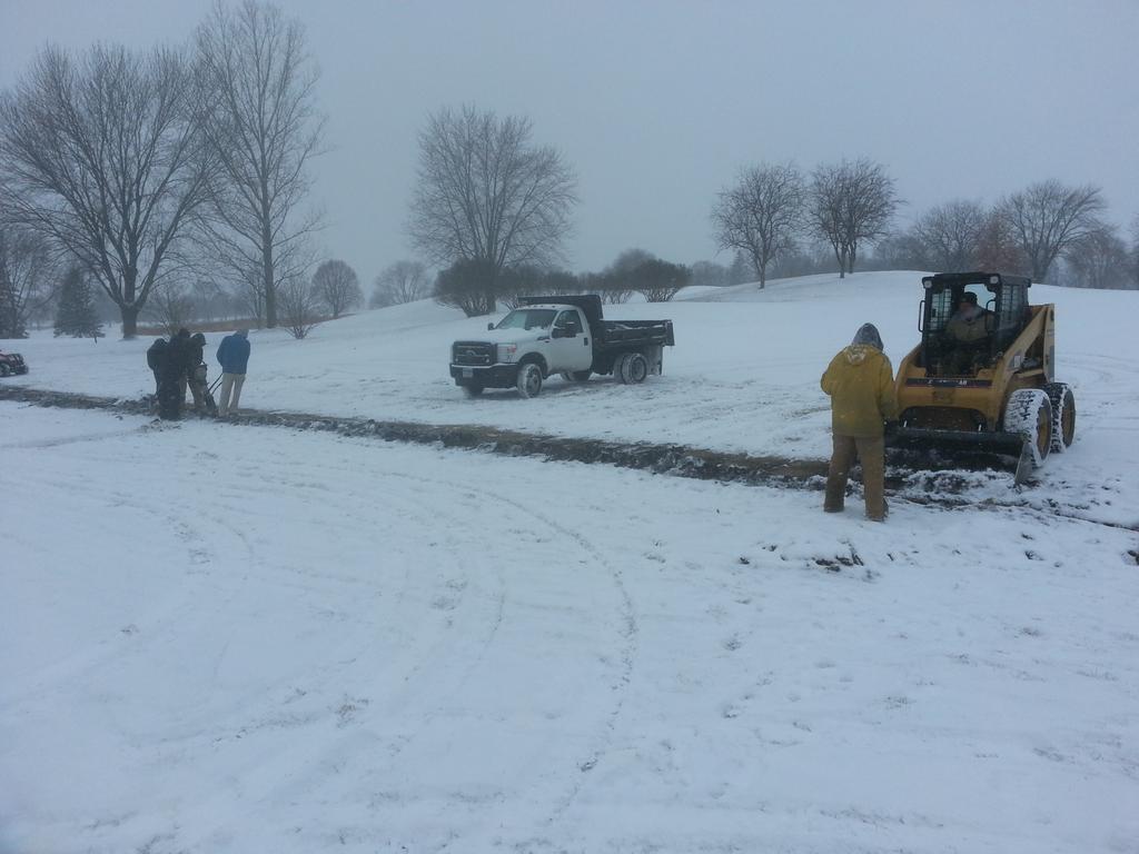 Finishing up a little drainage project in the snow.