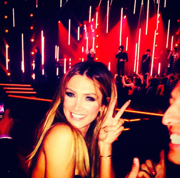 DeltaGoodrem's tweet photo. Yep! That's me singing along to @onedirection about to make @taylorhenders0n get up and dance 😃🎉 x http://t.co/AwjImdvCjV