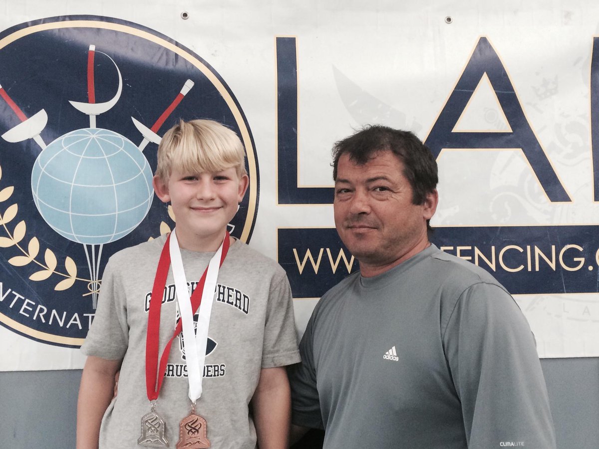 LAIFCfencing's tweet photo. #AsherBailey excited to show his medals to Saber Coach #DanielGrigore. http://t.co/fR5J1Llb6E