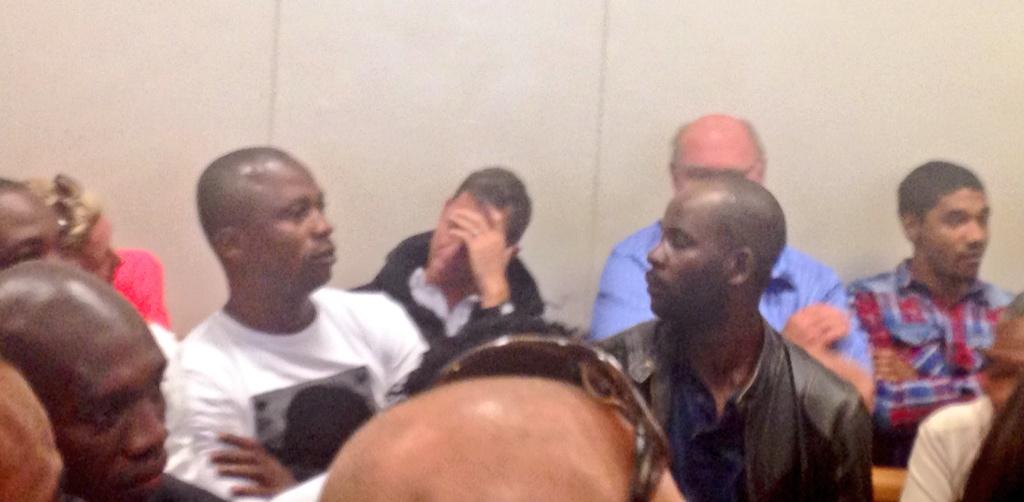 AthiMtongana's tweet photo. #TimOsrin with hand covering his face asked by police officer in court to remove hoddie covering his face @eNCAnews http://t.co/UXrm1cCOoT