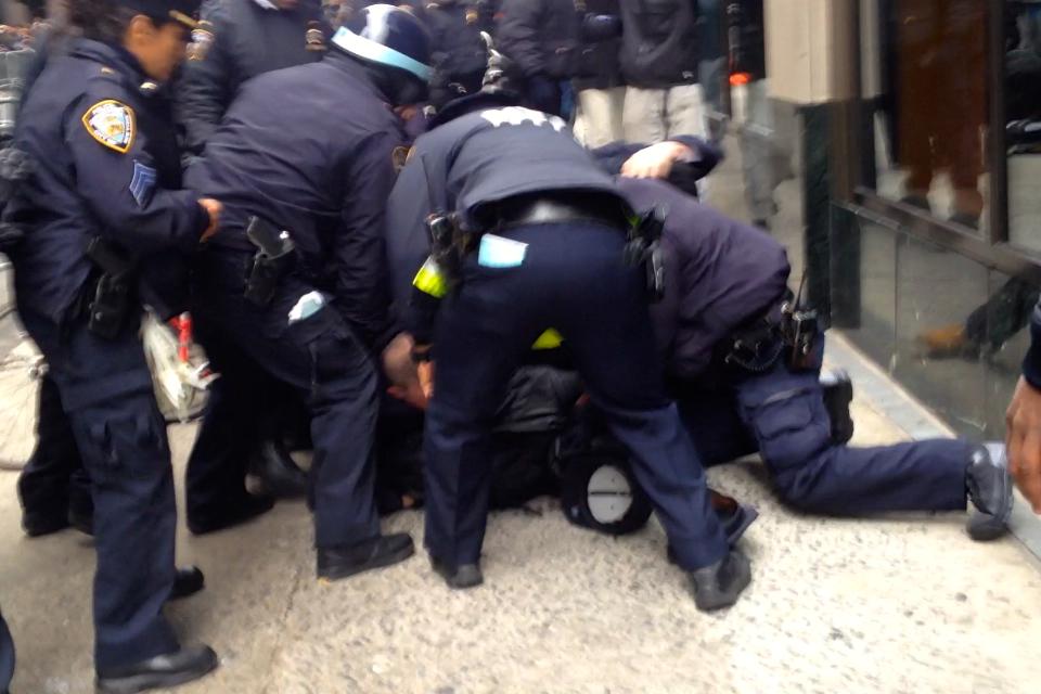 AshAgony's tweet image. #NYPD dogpiled on #StopTheParade protesters, swung batons at us 
&amp;amp; used batons to push us back! #MikeBrown #ACAB #NYC
