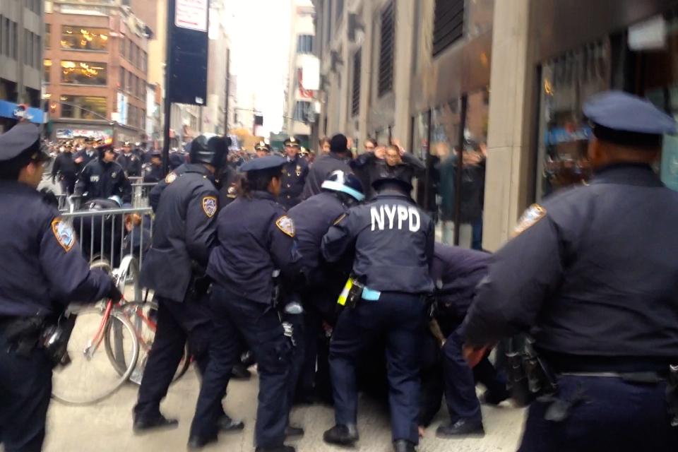 AshAgony's tweet image. #NYPD dogpiled on #StopTheParade protesters, swung batons at us 
&amp;amp; used batons to push us back! #MikeBrown #ACAB #NYC