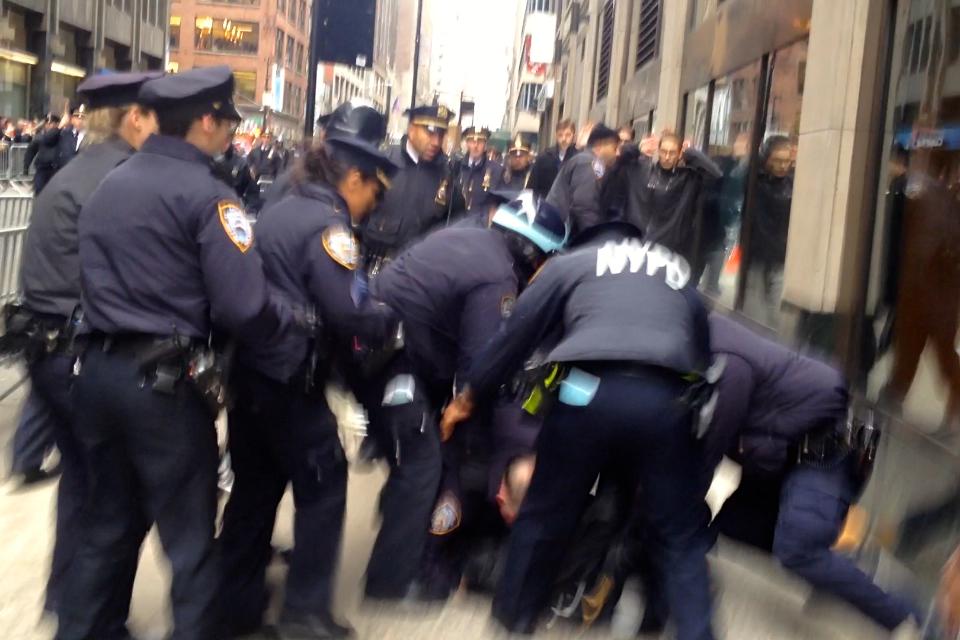 AshAgony's tweet image. #NYPD dogpiled on #StopTheParade protesters, swung batons at us 
&amp;amp; used batons to push us back! #MikeBrown #ACAB #NYC
