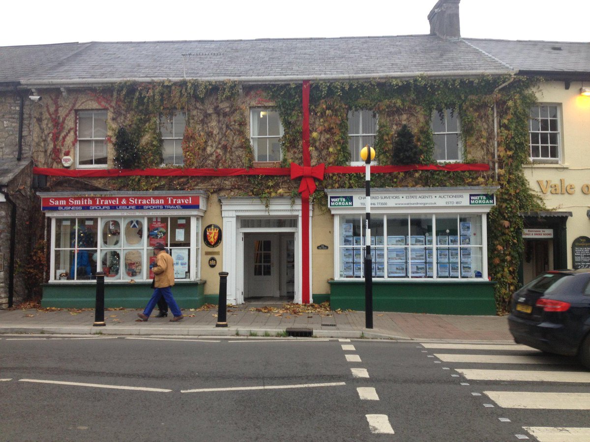 WattsandMorgan's tweet photo. Feeling very festive at our #Cowbridge office today, nibbling on @ElephantandBun Welsh cakes and admiring our bow! http://t.co/tUhUJ2GEnt