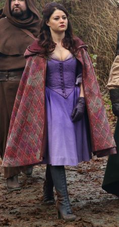 Belle walked down the narrow dirt road as she flatten out her purple dress before pulling her cloak hood --