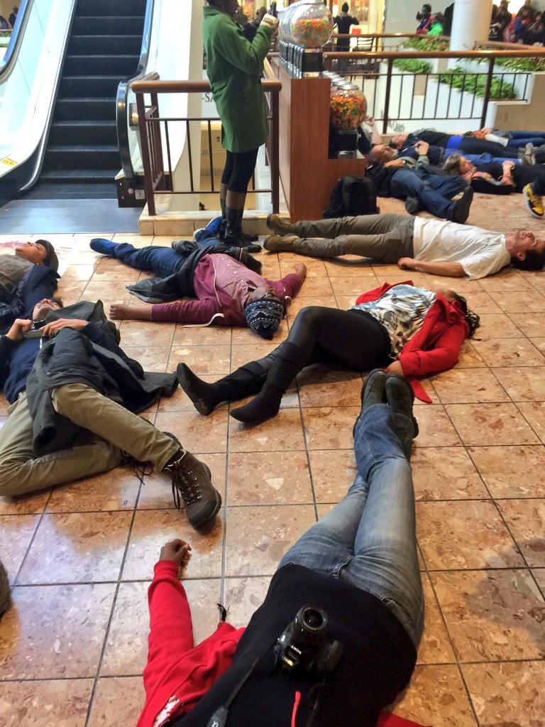 deray's tweet photo. Wrapped around the 2nd floor. We protest. #Ferguson http://t.co/7c6dkvoXvq