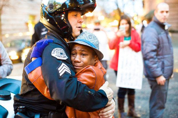 The power of this image out of #Ferguson is astronomical.  A #hug is #hope. bit.ly/1vuqwRE