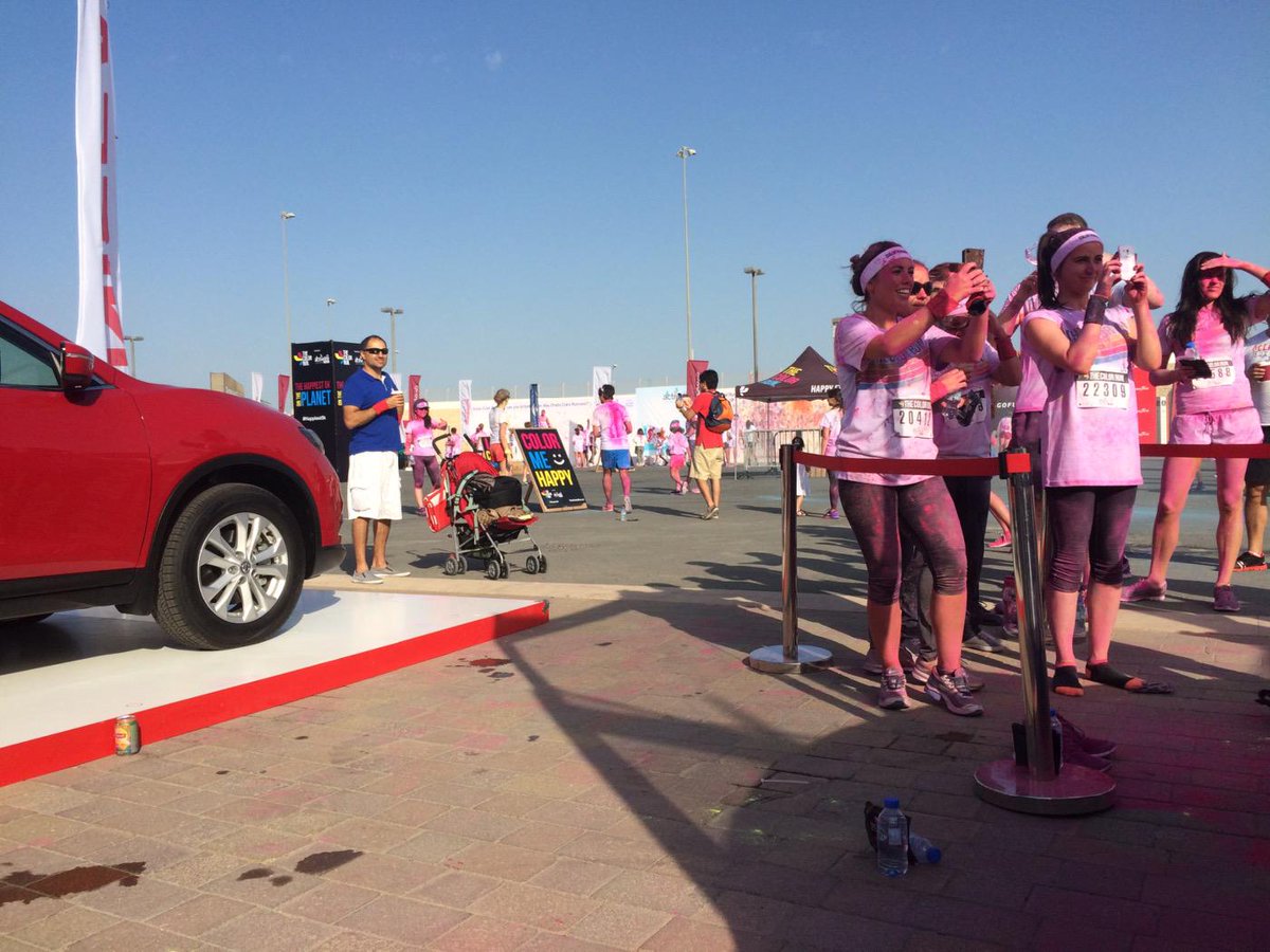 NissanDubai's tweet image. This is the Nissan stand at the #ColorRunUAE! Can you guess what's happening there? Hint: jump! #happiest5k