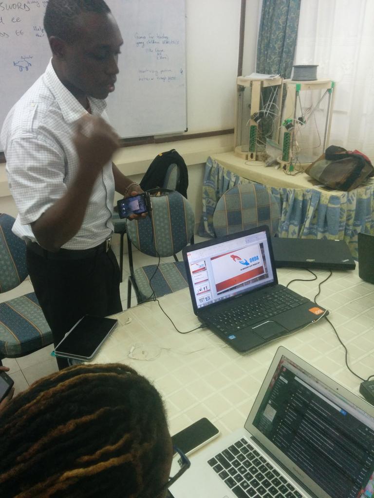 mjumbewu's tweet photo. First presentation at #icat2014 hackathon: Okoa - shake app for emergency contacts http://t.co/j6Gtg1PUPL