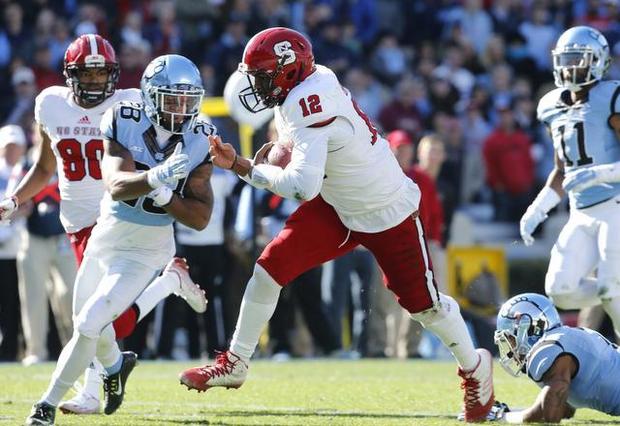 newsobserver's tweet photo. #NCState dominates #UNC for 35-7 win in Chapel Hill http://t.co/n1cpiq4CBk http://t.co/dG2r9SIoL5