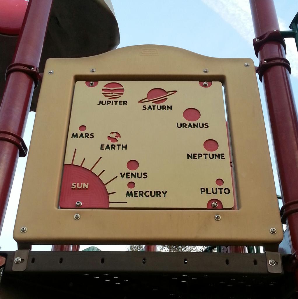 AnEvilLaugh's tweet photo. Pluto is still a planet. My playground says so. #IMissPluto :/ http://t.co/ZLEsx3FO8Z