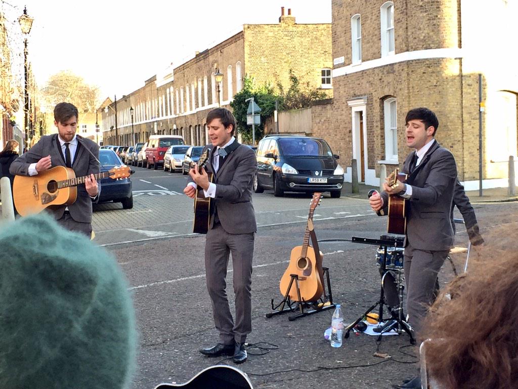 JackKessler1's tweet photo. Men in suits singing 'Help'. We've reached peak Columbia Road. http://t.co/JOpxgxePGA
