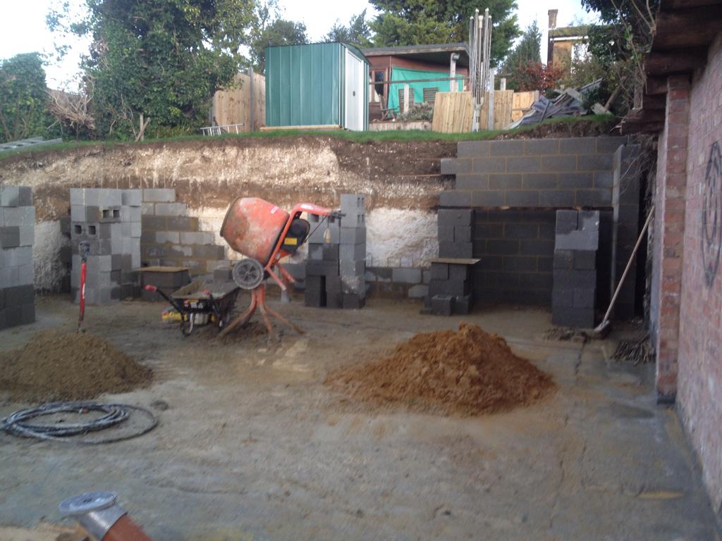 ExtendablesLtd's tweet photo. The Extendables ltd . Retaining wall well underway the annex will be up to damp course by the end of the week . http://t.co/htOKyk1Mof