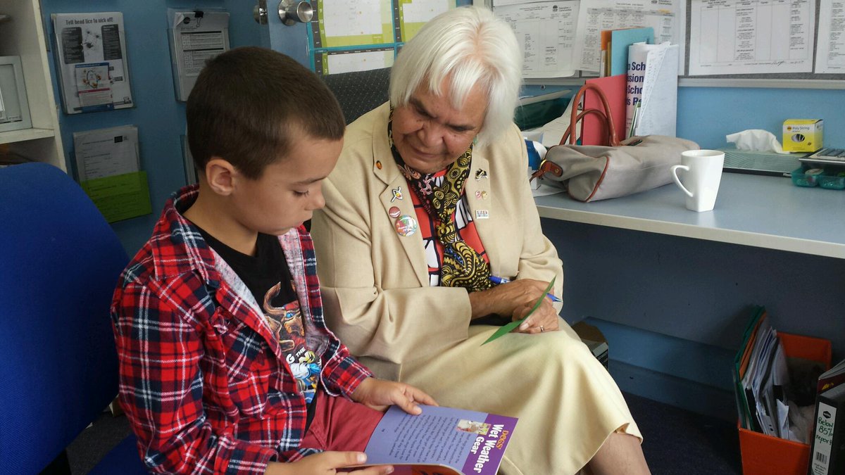 Aunty Mae Robinson reading with one of our deadly Aboriginal students.