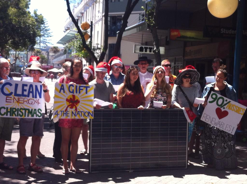 michaelfrost6's tweet photo. Carols singing outside the PM's office as we deliver solar panels to him. #MerryClimate http://t.co/rsKKgjMGMj