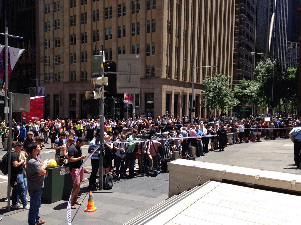A crowd gathers near Martin Place. #sydneysiege ab.co/1zmdiru @JezNews