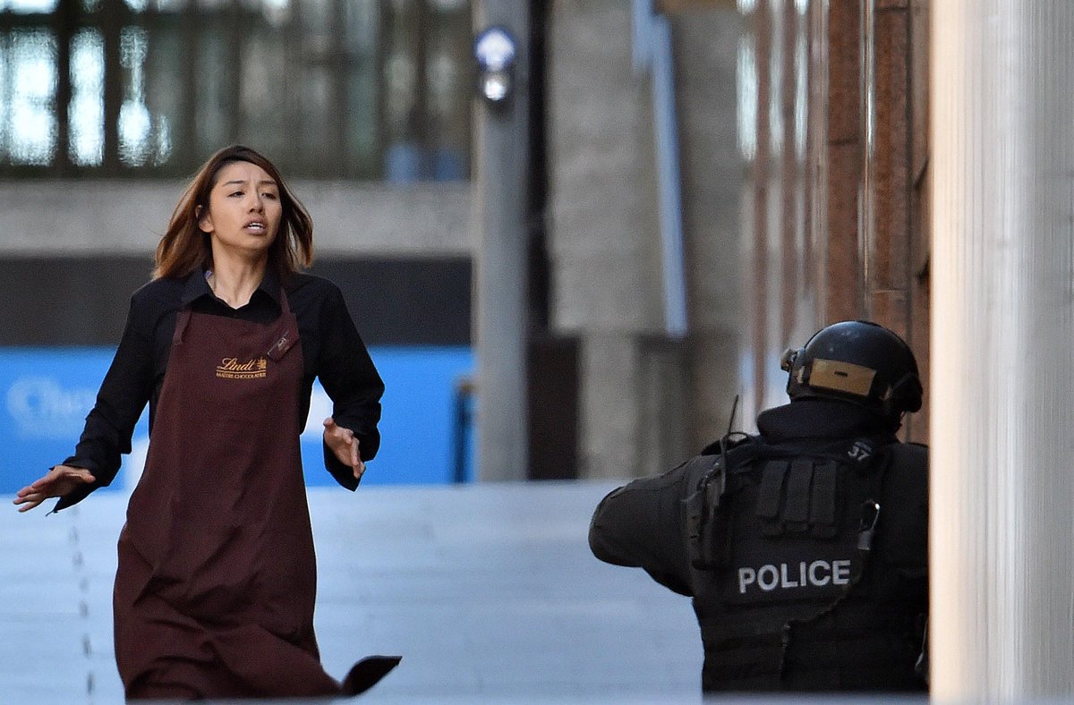cnni's tweet photo. Five free but an unknown number remain trapped in dramatic siege in Sydney: http://t.co/VUVPPrKuDc #sydneysiege http://t.co/oHEoDf8r3H
