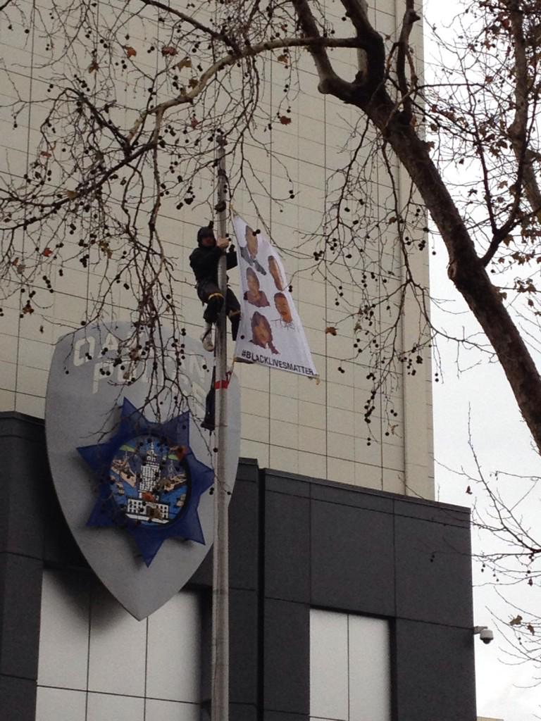 CalProgressives's tweet photo. Flag with unarmed black people killed by police flying at #shutdownOPD #BlackAndBreathing #BlackLivesMatter http://t.co/FA4rvqDYCY