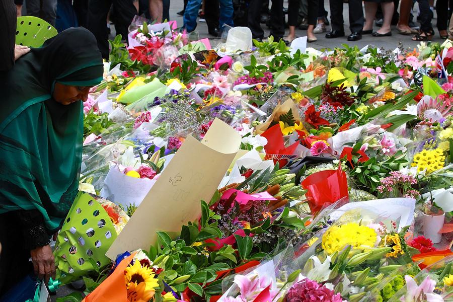 photosSMH's tweet photo. PHOTO: People lay flowers at Martin Place in memory of Tori Johnson &amp; Katrina Dawson.  #MartinPlace @smh http://t.co/KD4re7dxtK