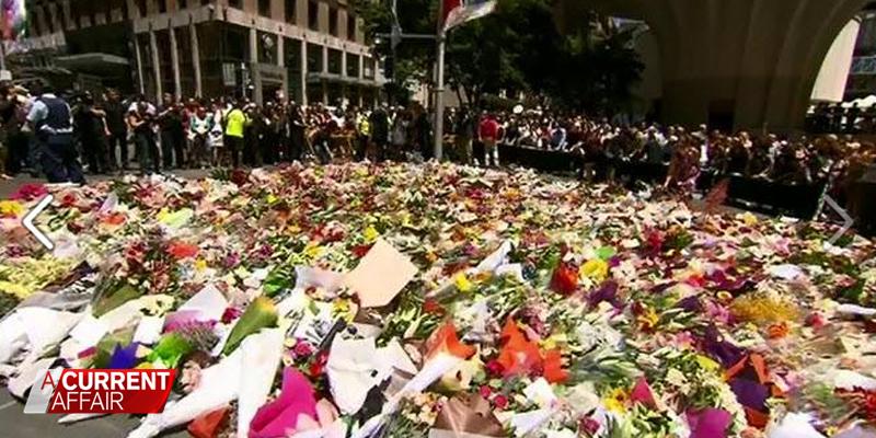 ACurrentAffair9's tweet photo. "This is what love looks like when we don't actually know the people involved." - @camjwilliams #SydneySiege #ACA9 http://t.co/KuLEjmwjY8