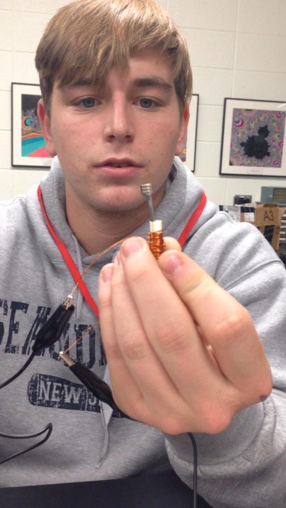 STEM students build solenoid actuator for doorbell. Press button and nail jumps! One student said "this is magic".