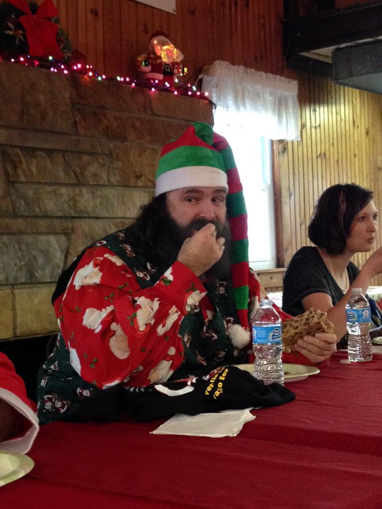 SantaClausInd's tweet photo. The International Fruitcake Eating Championship w @realmickfoley via @SantasCandyCasl http://t.co/XtPqLkLICU