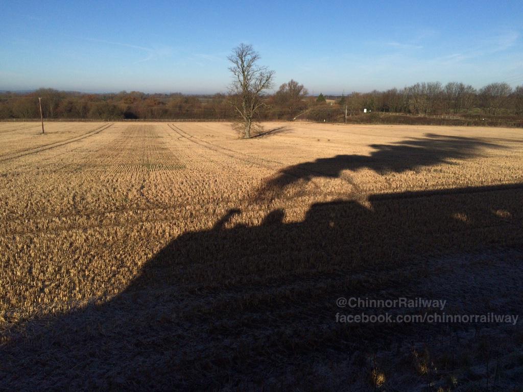 ChinnorRailway's tweet photo. A silhouette of #GWR 1369 departing Horsenden lane for #Chinnor. The old #Thame branch is in the distance. #Chilterns http://t.co/QKQoSq8EwB