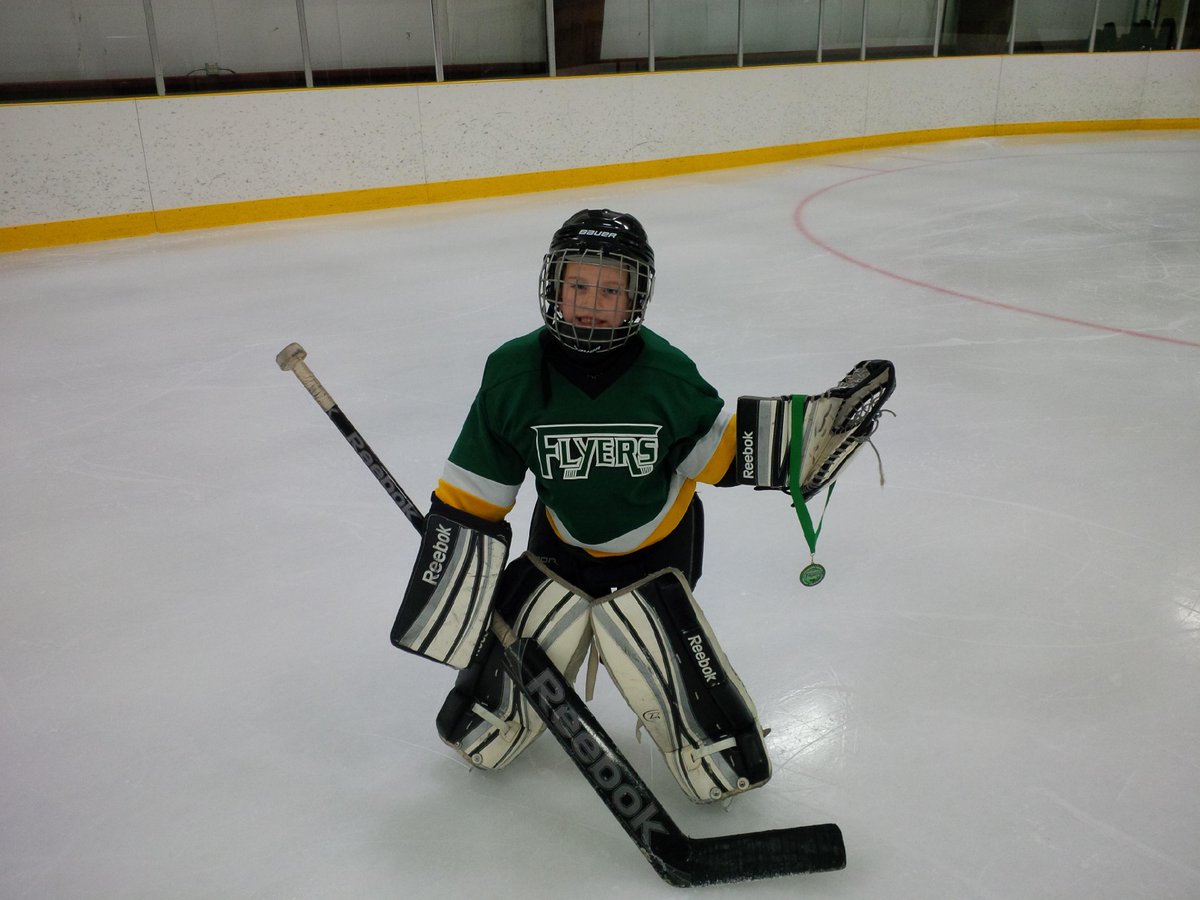 BeatonTrevor's tweet image. My little goalie with his metal. #pokecheck #saveitwithhisface