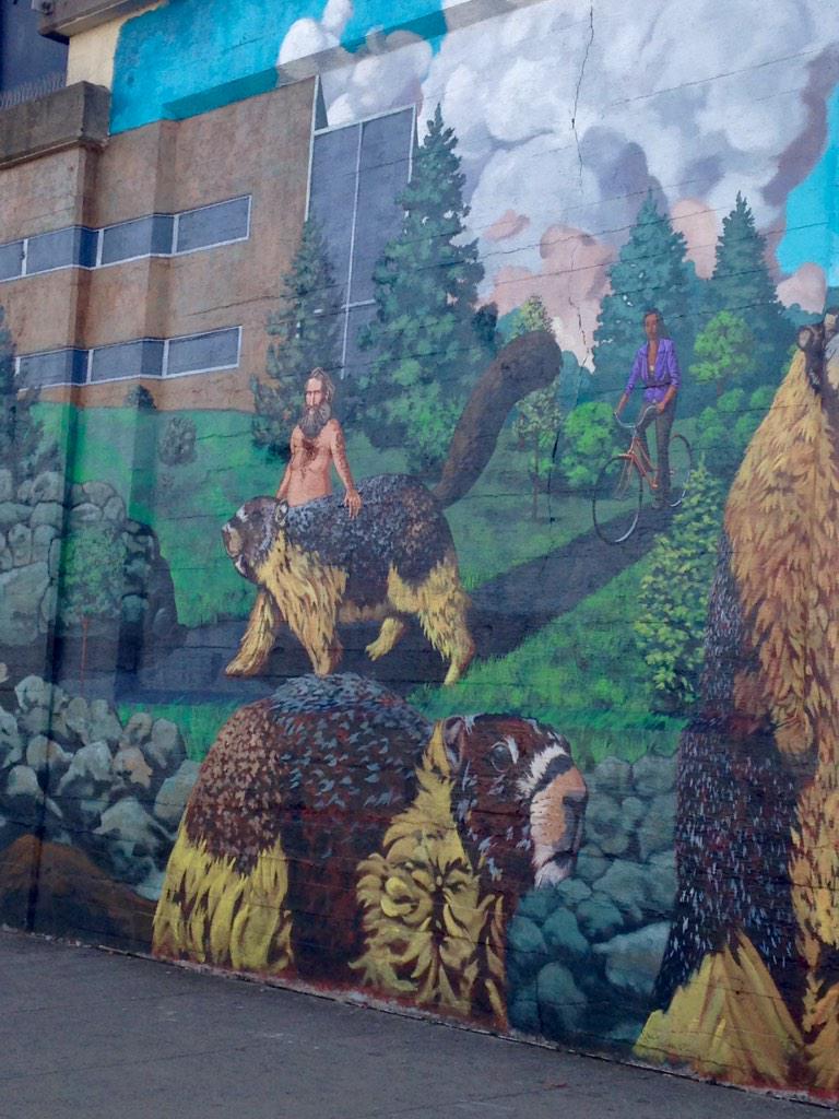 NorthernAmelia's tweet photo. Only in Spokane is there a mural of a naked man walking a squirrel http://t.co/XpheYwIi8T