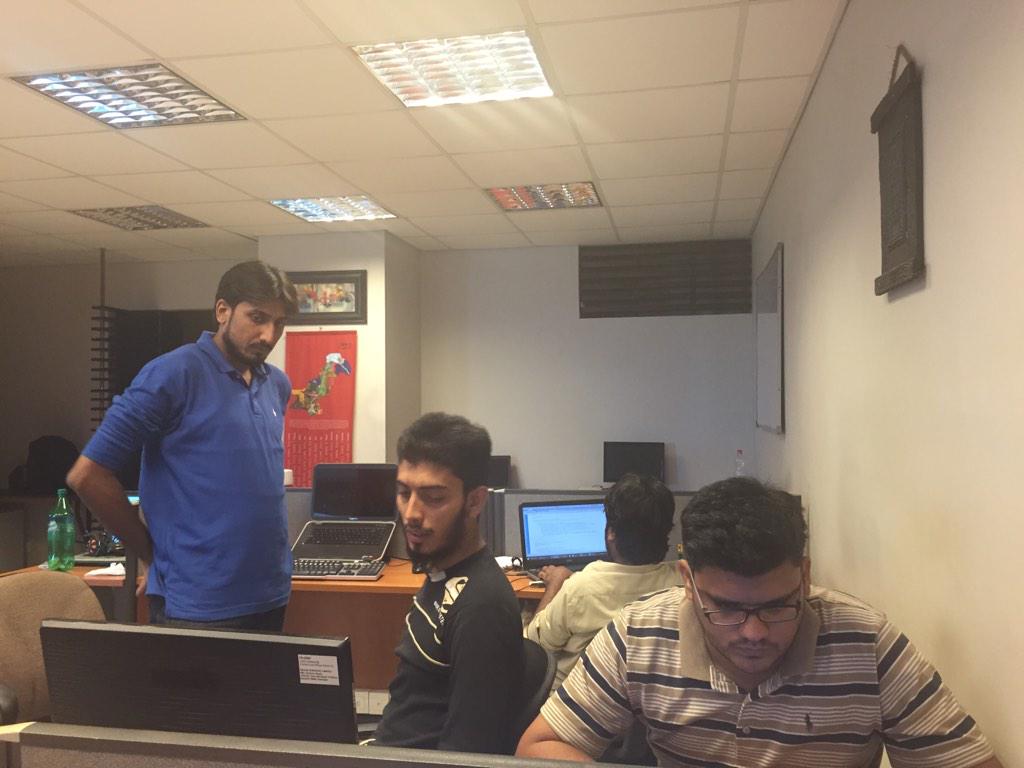 iRehanAli's tweet photo. Team #RIKSOF work hard to finish its task on time for #hackathon @koding http://t.co/mIDKgX8oAG
