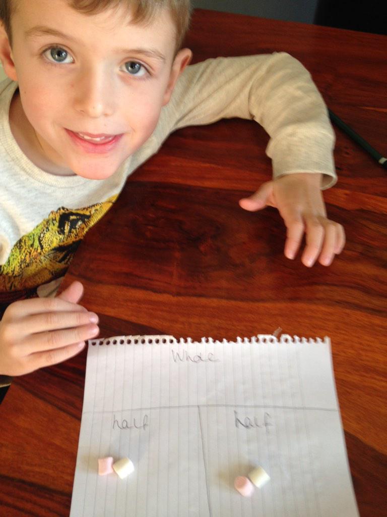 Zac doing his homework, halving his numbers!!