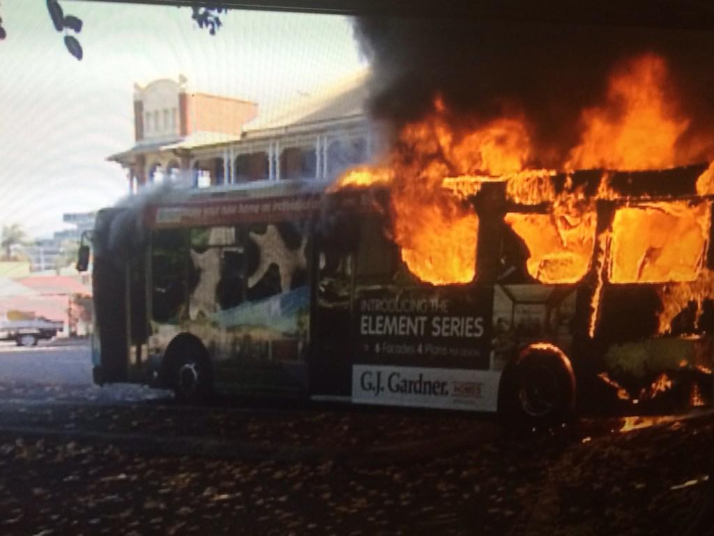 ClareBarnes_10's tweet photo. A public bus bursts into flames on the Strand @7LocalNewsTSV http://t.co/8J4dv3keWn