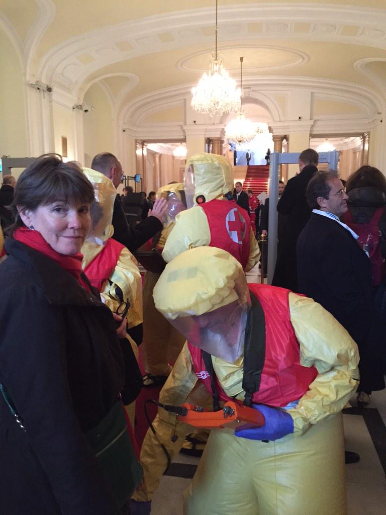 CoreyAH's tweet photo. Some decontamination theater before being allowed entry into #HINW14vienna. @NTI_WMD's Carmen MacDougall was cleared. http://t.co/qHs5ox6Odk