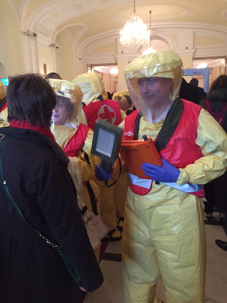 CoreyAH's tweet photo. Some decontamination theater before being allowed entry into #HINW14vienna. @NTI_WMD's Carmen MacDougall was cleared. http://t.co/qHs5ox6Odk