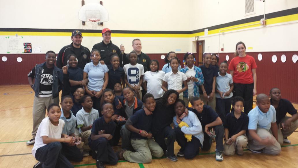 4th K. Haynes and 5th L Fryer students play hockey with members of Blackhawks and Mr. Boatwright P.E class #Awesomee