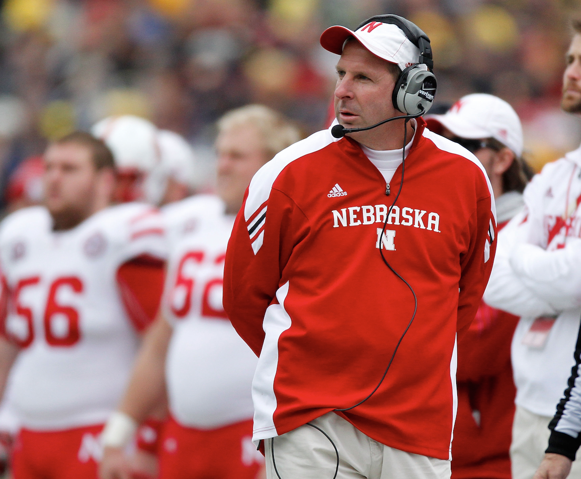 Jim tressel hires bo pelini to be the next head football coach at youngstown state