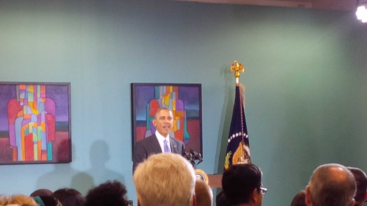 Hola, como esta? Obama greets the audience at Casa Azafran in Nashville.