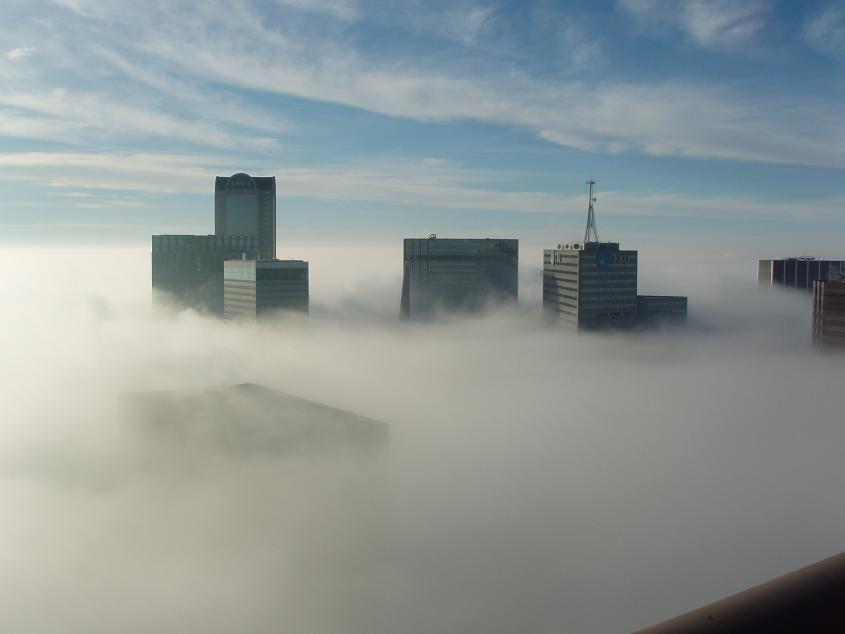 terryapodaca's tweet photo. I've seen this before...not the actual photo but the Dallas skyline under clouds/fog. http://t.co/zQ52HTDaLM