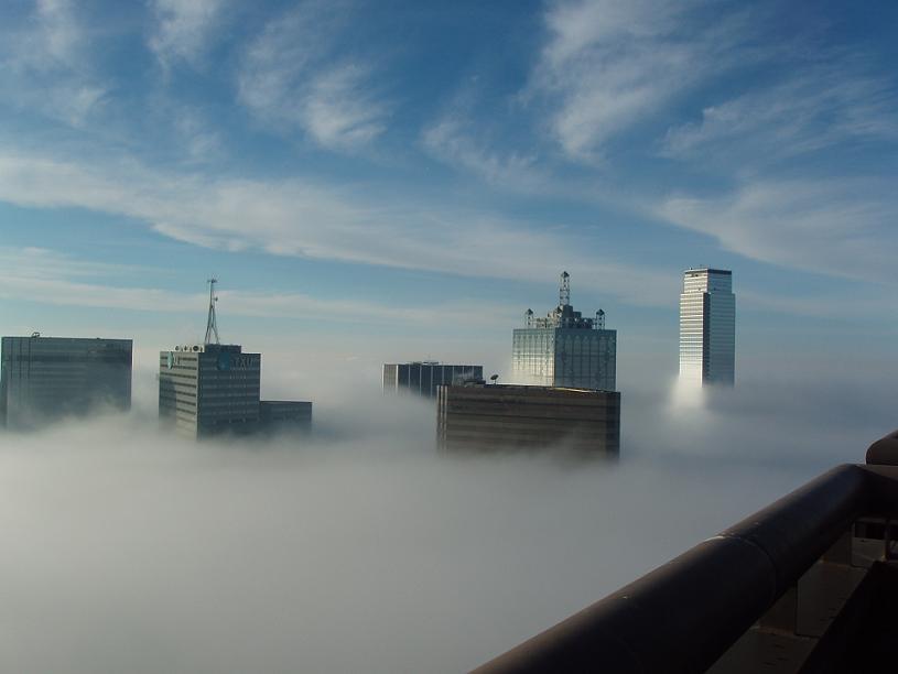 terryapodaca's tweet photo. I've seen this before...not the actual photo but the Dallas skyline under clouds/fog. http://t.co/zQ52HTDaLM