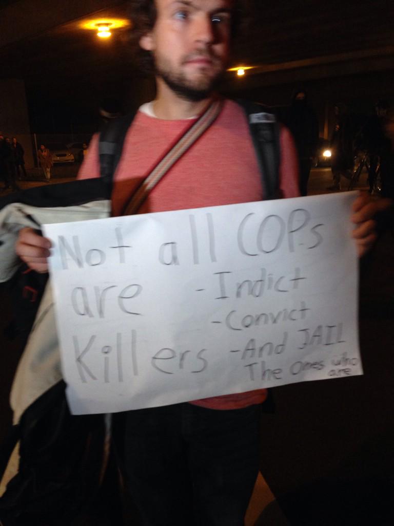 berkeleyside's tweet photo. Protest is now firmly in Oakland. Scott carried sign saying Not All Cops Are Killers. #BerkeleyProstests http://t.co/AKGtaLD7Rj